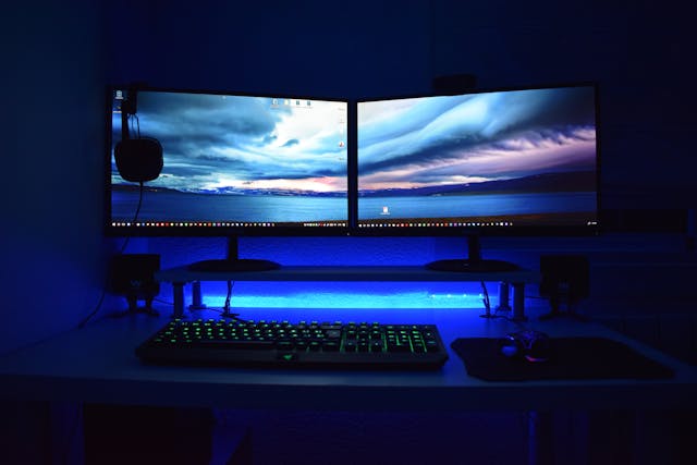 two-computer-flat-screen-monitors-turned-on